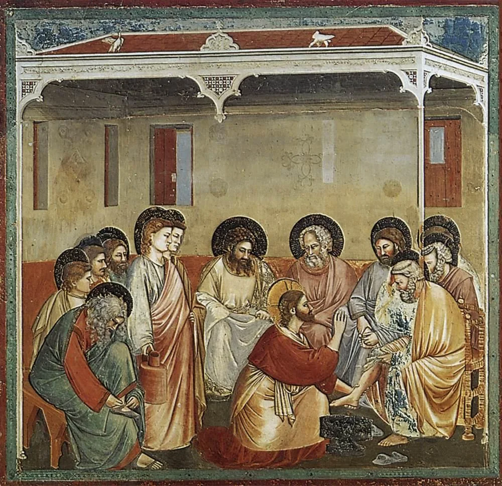 Giotto’s fresco of Jesus kneeling to wash Peter’s feet while the other disciples look on
